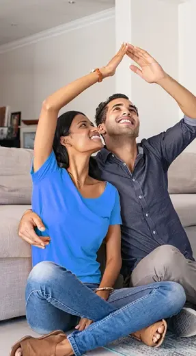 Happy couple in their new home